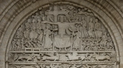 Romanesque stone tympanum of the Abbey Church of Saint-Pierre in Beaulieu-sur-Dordogne, France.