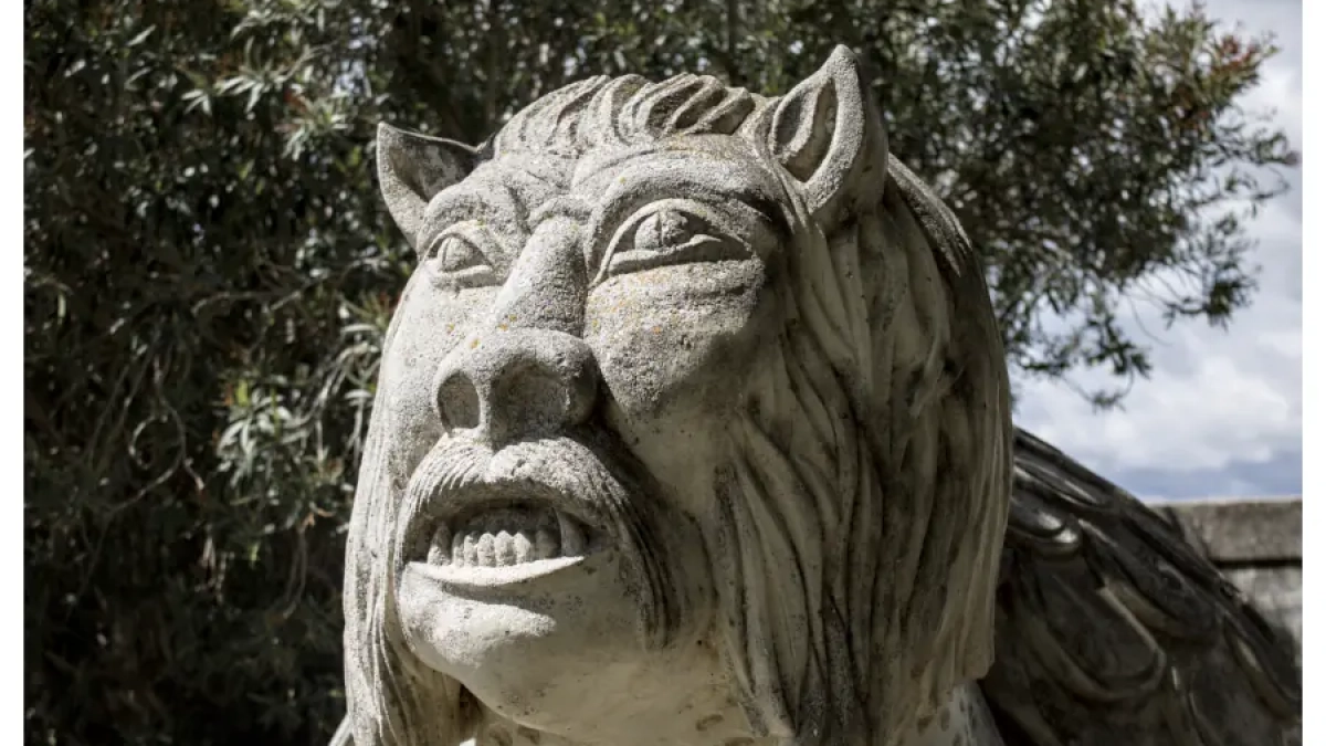 Stone sculpture of the legendary Tarasque creature in Tarascon, France.